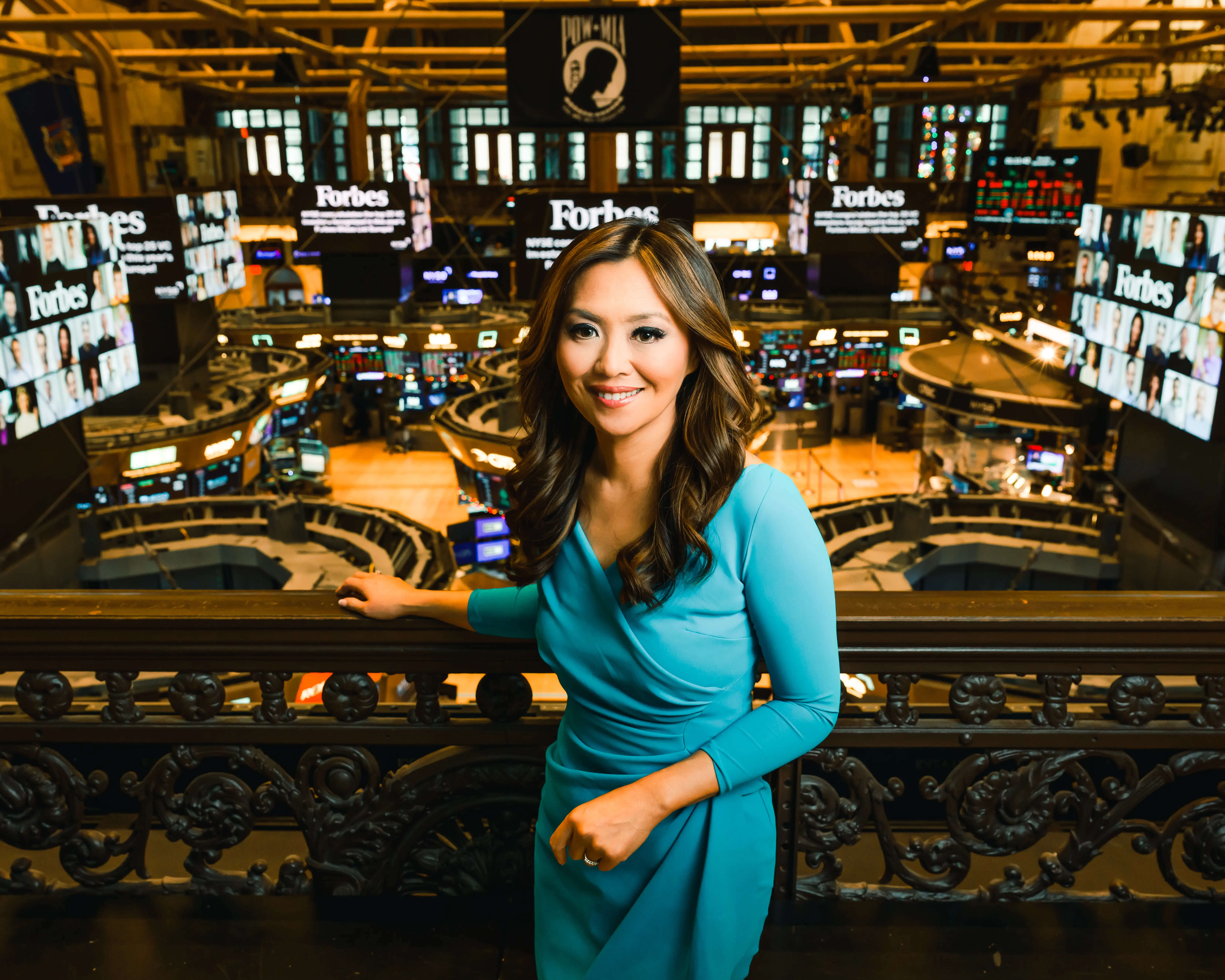Remy Blaire on the balcony of the New York Stock Exchange reporting during a pivotal market session